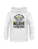 A white hoodie with funny tennis slogan on the front that reads 'A white ceramic mug with tennis slogan on the front that reads 'I Wake Up Every Morning and Still Can’t Believe I Actually Make a Living Playing Tennis.'