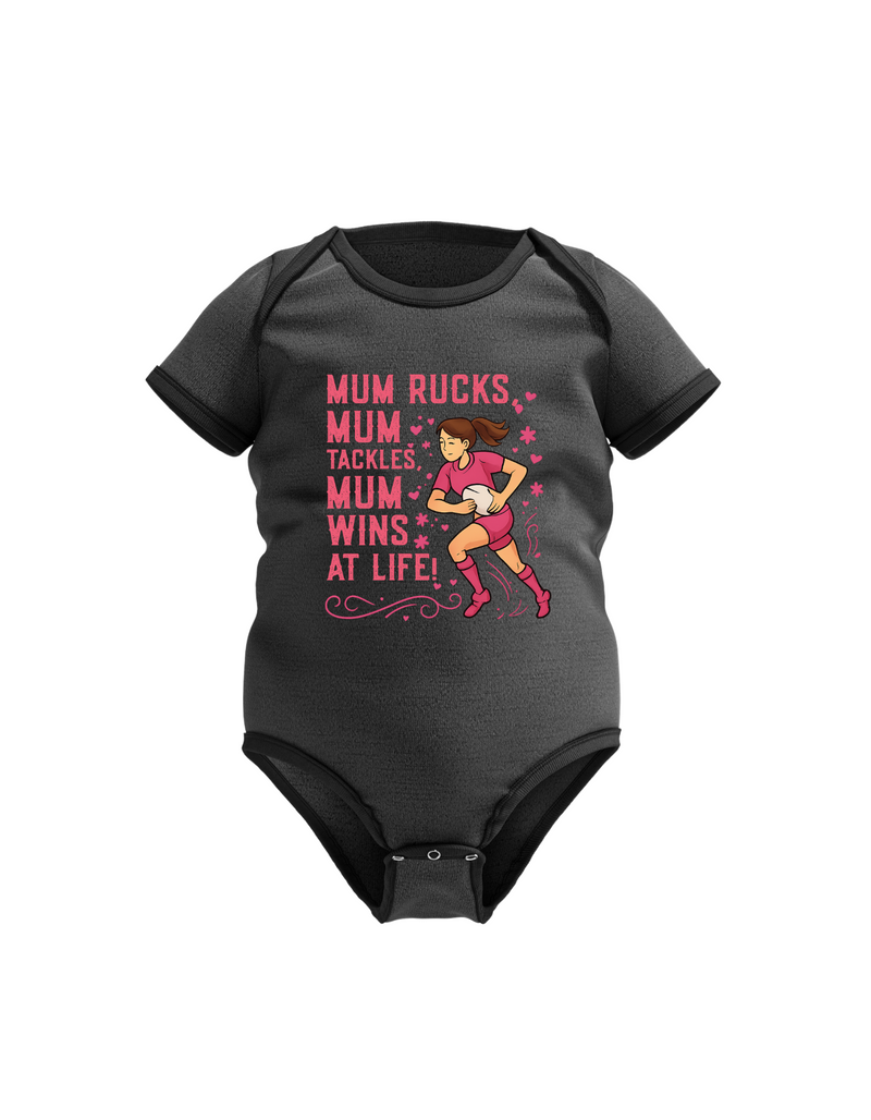 Black baby onesie with pink text and graphic on a white background, with the slogan on the front 'Raised by a Rugby Mum, Fearless for Life
