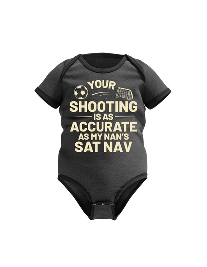 A black baby grow with the funny football slogan on the front that reads 'Your Shooting Is As Accurate as My Nan’s Sat Nav'