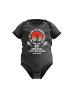 A black baby grow with the funny tennis slogan on the front reading 'I Love the Winning, I Can’t Take the Losing, but Most of All I Just Love To Play'