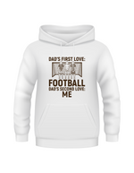A white hoodie with the funny football slogan on the front saying 'Dad’s First Love: Football. Dad’s Second Love: Me'