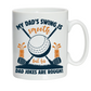 White mug with golf-themed design and text on a white background with a Cows Corner slogan saying My dad's swing is smooth, but his jokes are rough.