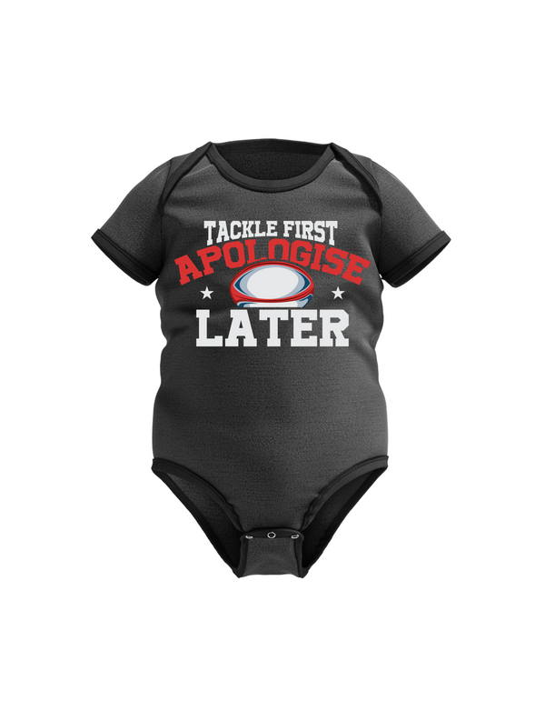 Black baby onesie with humorous text design on a white background with a Cows Corner tackle first apologise later