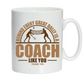 A white mug with the funny tennis coach saying on the front that reads 'Behind Every Great Rally Is a Coach Like You – Thank You'