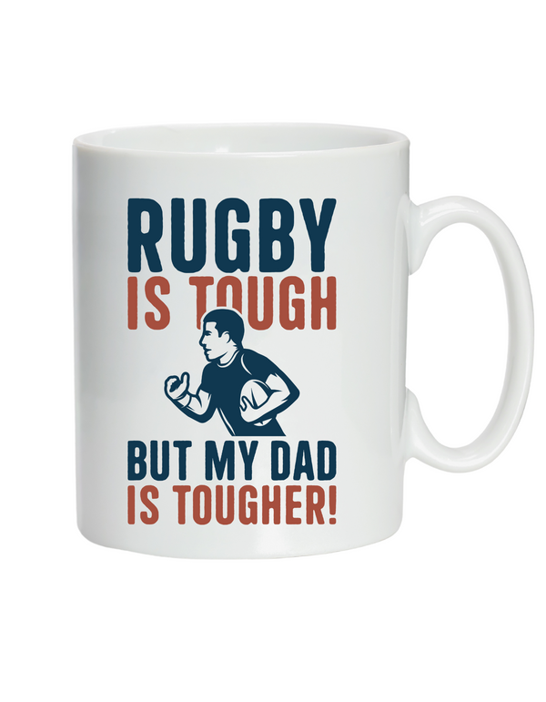 Mug with 'Rugby is tough, but my dad is tougher!' text and graphic on a white background with a Cows Corner slogan saying Rugby is tough, but my dad is tougher
