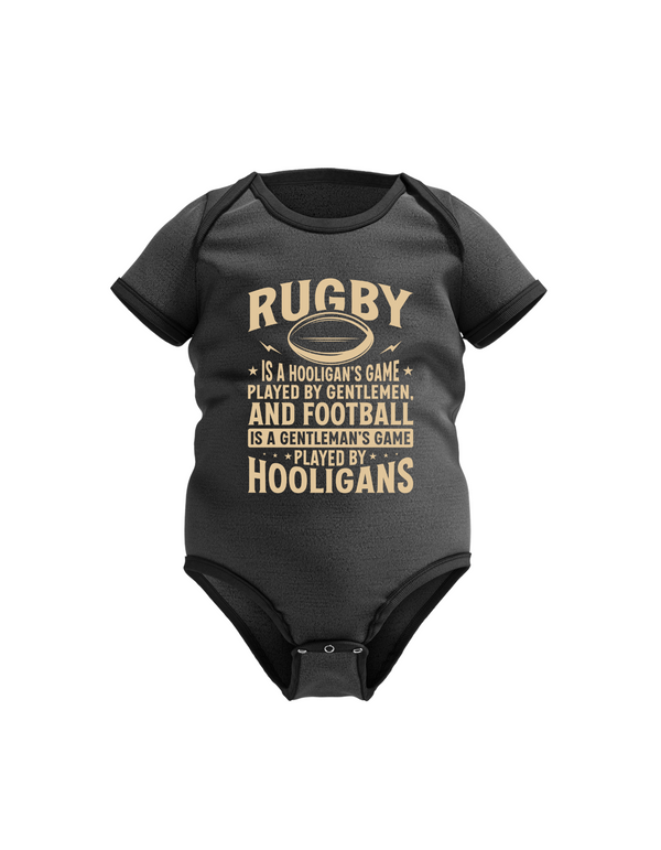 Black baby onesie with gold text on a white background with slogan on the front, Rugby Is a Hooligan’s Game Played by Gentleman, and Football Is a Gentleman’s Game Played by Hooligans