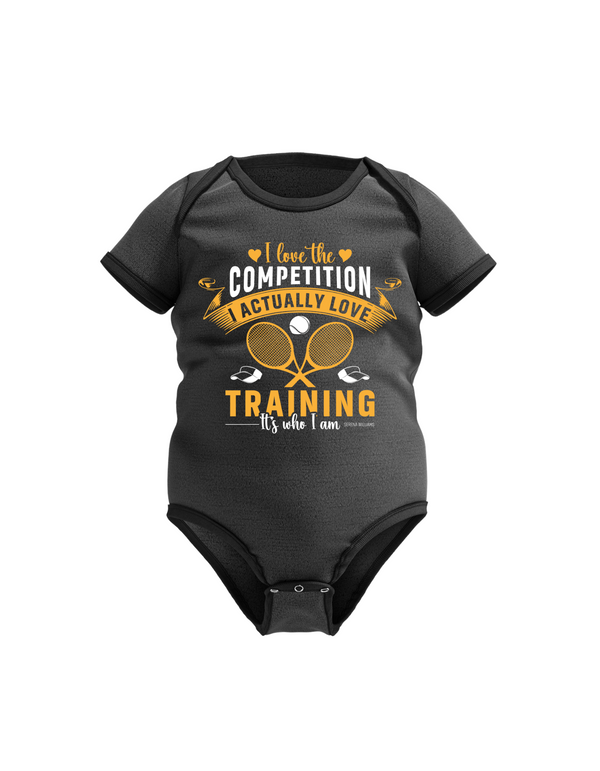 A black baby grow with a funny tennis slogan on the front saying 'I Love the Competition, I Actually Love Training, It’s Who I Am – Serena Williams!  