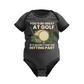 Gray baby onesie with golf-themed text and graphics on a white background with Cows Corner slogan, you'd be great at golf if it wasn't for the hitting part.