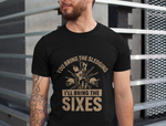 A man wearing a black t-shirt with You Bring The Sledging, I'll Bring The Sixes on the front. A Funny Cricket T-Shirt, Premium Fabric, Multiple Adult Sizes