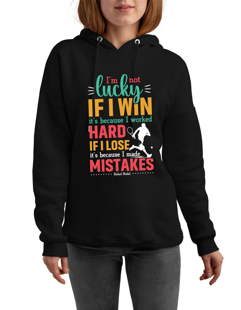 A lady wearing a black hoodie with a funny tennis slogan on the front saying 'I’m Not Lucky if I Win, It’s Because I Worked Hard if I Lose, It’s Because I Made Mistake – Rafael Nadal