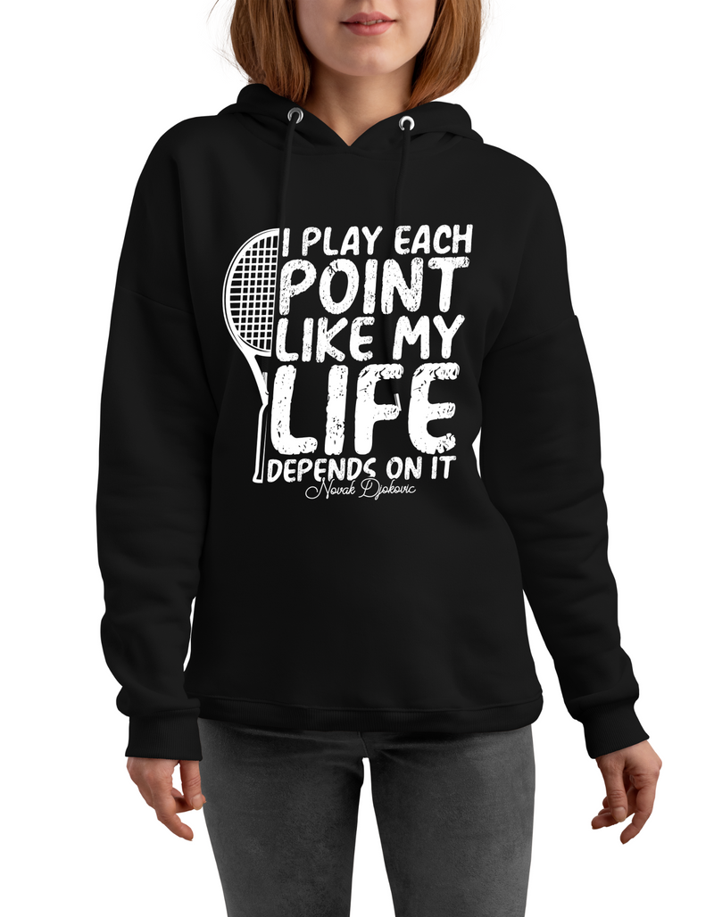 A lady wearing black hoodie with 'I Play Each Point Like My Life Depends on It – Novak Djokovic' funny tennis slogan on the front
