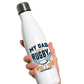 White water bottle with rugby-themed text held by a hand on a white background, with a slogan on the front saying 'My Dad Plays Rugby. What’s Your Superpower?