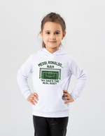 A little girl wearing a white hoodie with the funny football and dad loving slogan on the front which reads 'Messi, Ronaldo…Nah ’My Dads the Real Goat!'