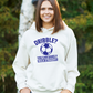 A lady wearing a white hoodie with a funny football slogan on the front that reads 'Dribble You Can Barely Walk Straight!'