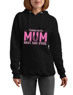 A lady wearing a black hoodie with the lovely tennis saying on the front which reads 'Tennis with Mums. Best. Day. Ever!'
