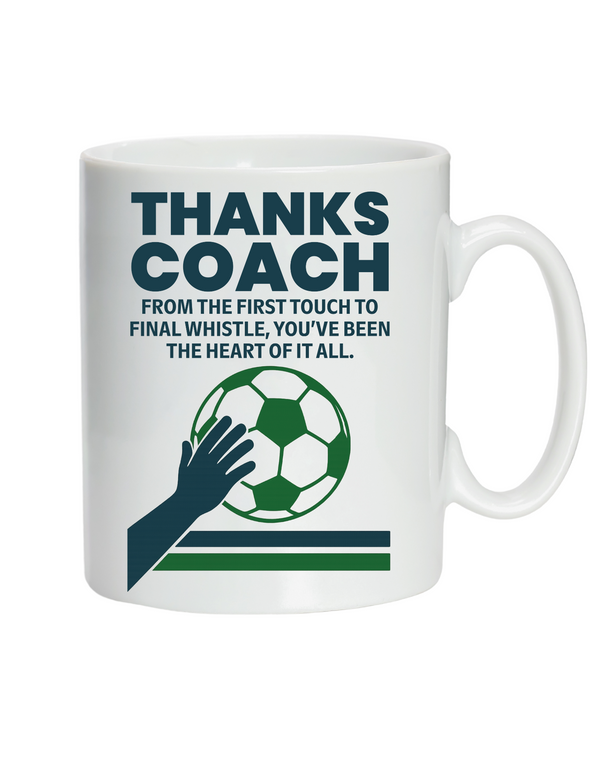 White mug with soccer-themed design and text on a white background with Cows Corner slogan saying Thanks Coach, from the first touch to final whistle, you've been the heart of it all