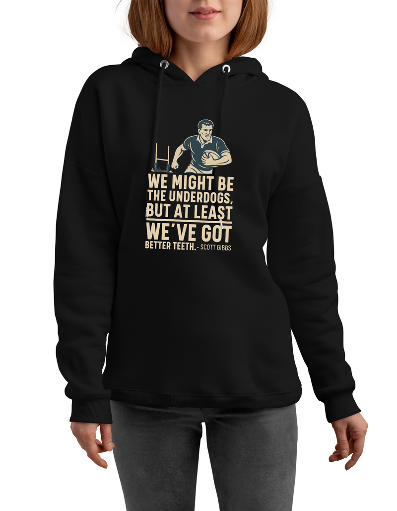 Person wearing a black hoodie with a graphic and text on a white background, with slogan on the front saying 'We Might Be the Underdogs, but at Least We’ve Got Better Teeth – Scott Gibbs