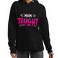 A lady wearing a black hoodie with the lovely tennis saying on the front that reads 'Mum Taught Me To Hit Hard and Dream Big!'