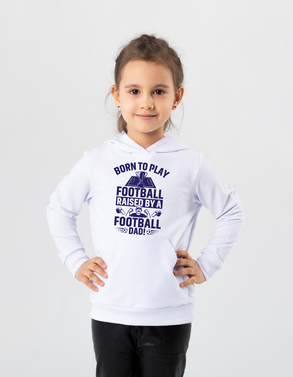 A little girl wearing a white hoodie with the funny football saying that says I love my dad 'Born To Play Football. Raised by a Football Dad!'