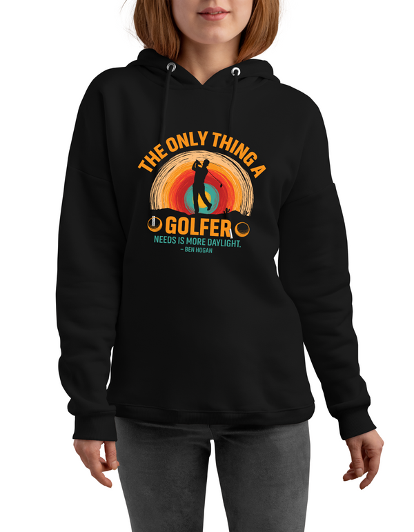 Black hoodie with colorful graphic and text worn by a person on a white background with a Cows Corner slogan saying The only thin a gold needs is more daylight - Ben Hogan