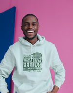 A man wearing a white hoodie with a funny tennis slogan on the front saying 'Winning Wimbledon Was a Great Feeling, but I Hadn’t Started Shaving Yet – Boris Becker'