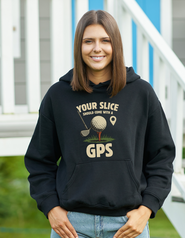 Person wearing a black hoodie with a golf-themed design, standing outdoors with a Cows Corner slogan saying Your slice should come with a GPS