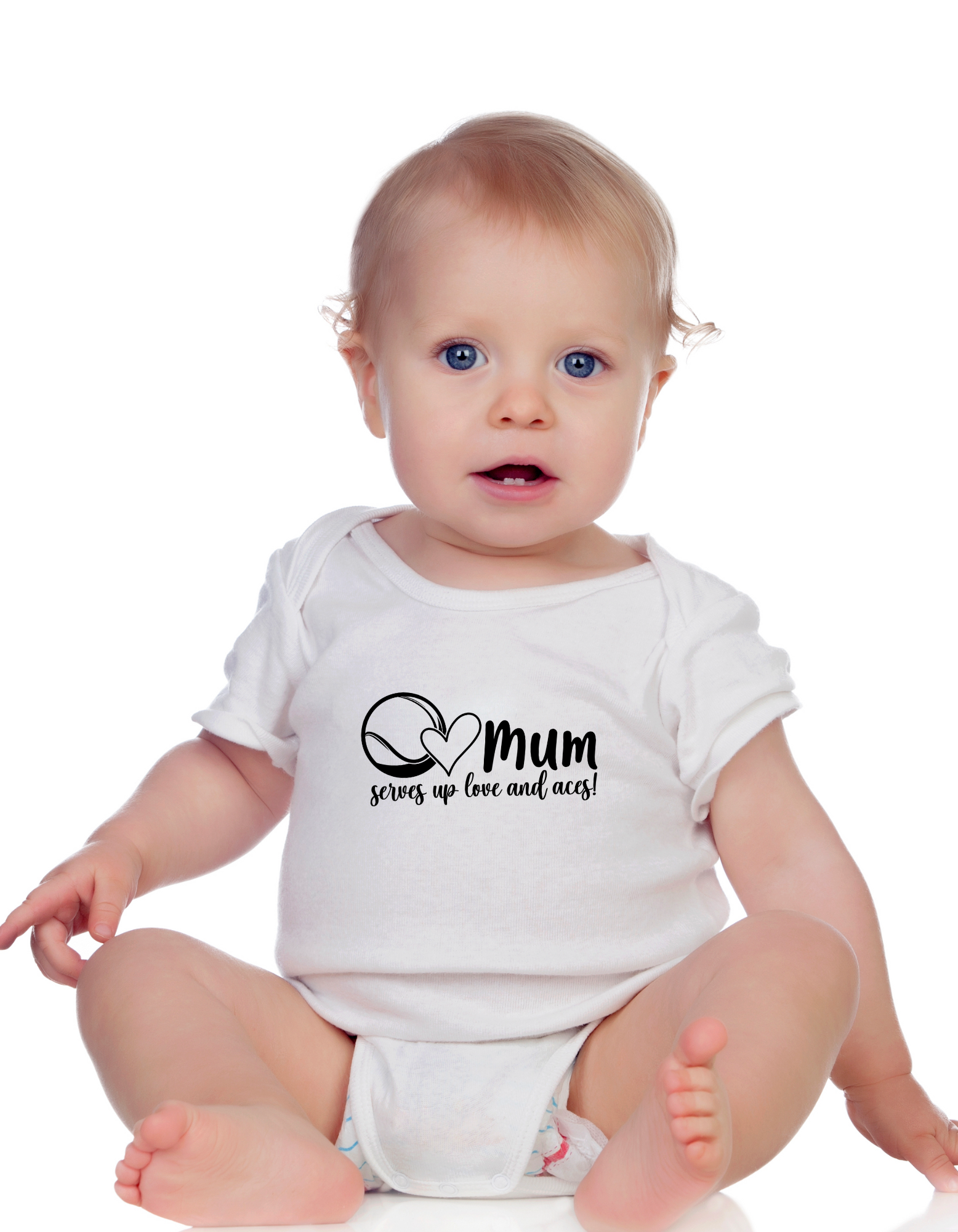 A little baby wearing a white baby grow with tennis slogan on the front that reads 'Mum Serves Up Love and Aces'.