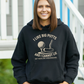 A black hoodie with the funny golf saying on the front that reads 'I Like Big Putts and I Cannot Lie, but Yours Are Embarrassing'