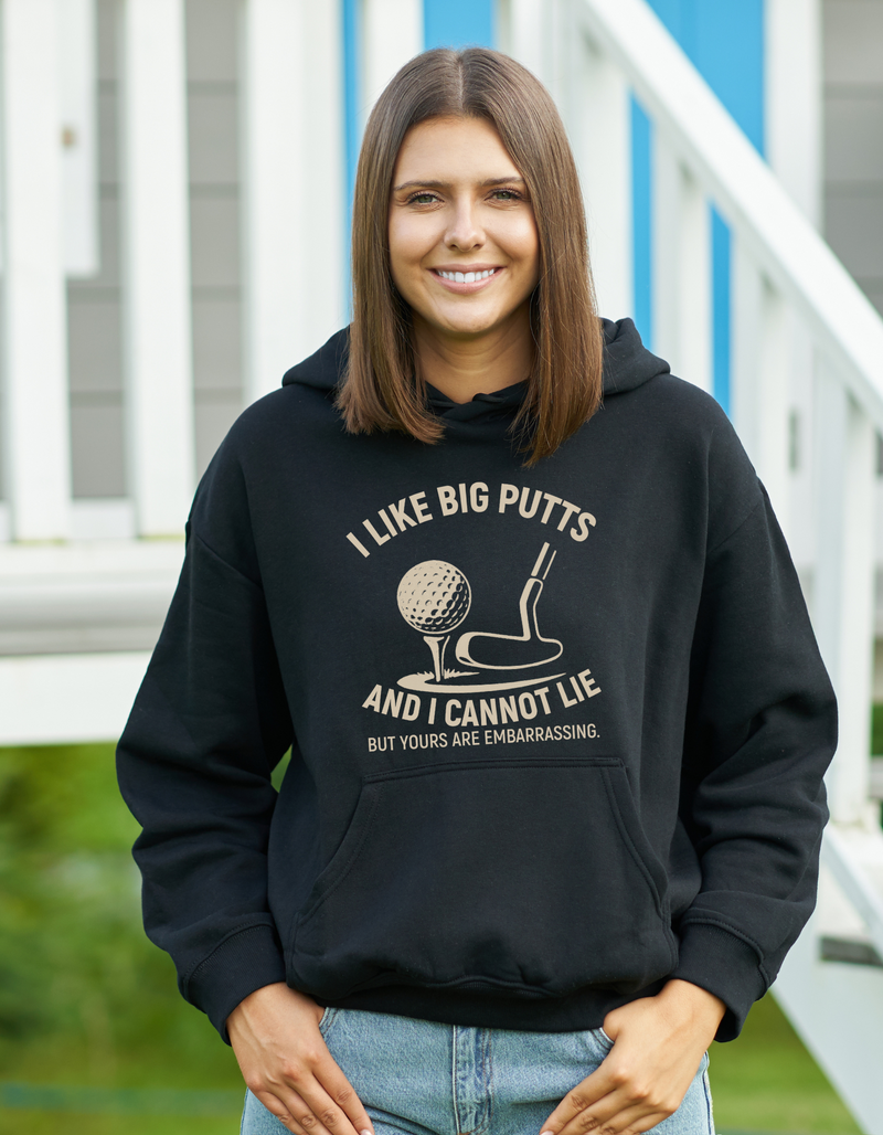 A black hoodie with the funny golf saying on the front that reads 'I Like Big Putts and I Cannot Lie, but Yours Are Embarrassing'