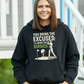 A black hoodie with the funny golf saying on the front that reads 'You Bring the Excuses, I’ll Bring the Birdies'