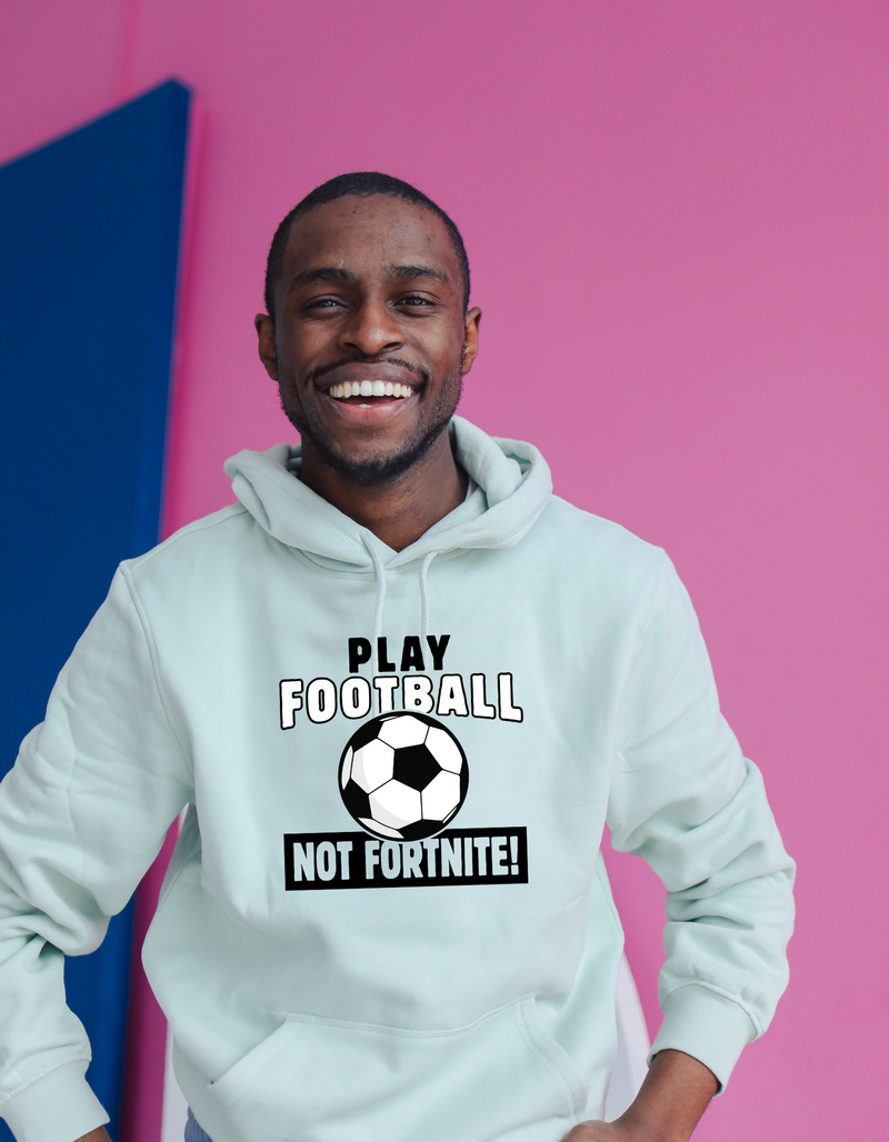 A man wearing a white hoodie with the funny football slogan written on the front that reads 'Play Football Not Fortnite!