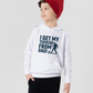 A young boy wearing a white hoodie with the funny football slogan on the front saying 'I Get My Tekkers From Dad'