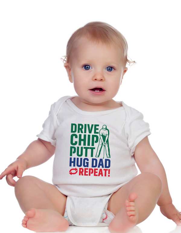Baby wearing a white onesie with colourful text on a white background with a Cows Corner slogan saying Drive, Chip, Putt, Hug Dad, Repeat. 