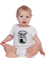 Baby wearing a white onesie with a humorous graphic and text.