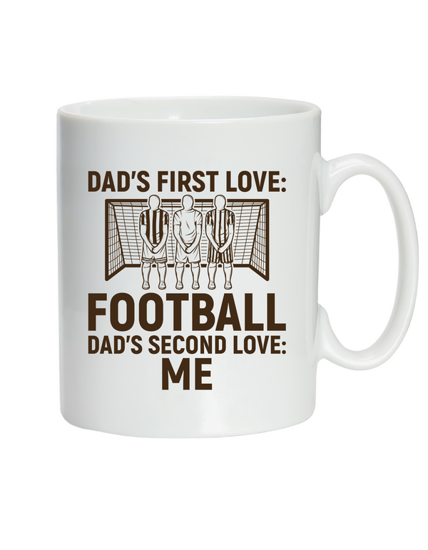 A ceramic white mug with the funny football saying on the front saying 'Dad’s First Love: Football. Dad’s Second Love: Me'