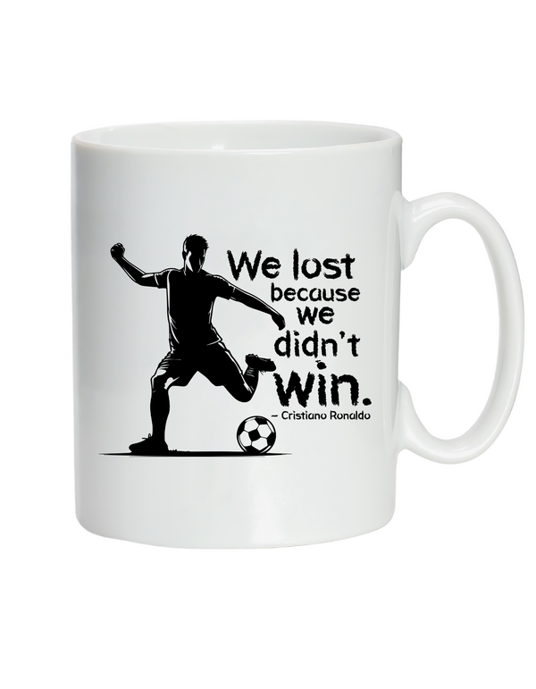 White mug with soccer-themed design and text on a white background with the Cows Corner slogan, We lost because we didn't win - Cristiano Ronaldo