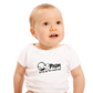 A little baby wearing a white baby grow with tennis slogan on the front that reads 'Mum Serves Up Love and Aces'.