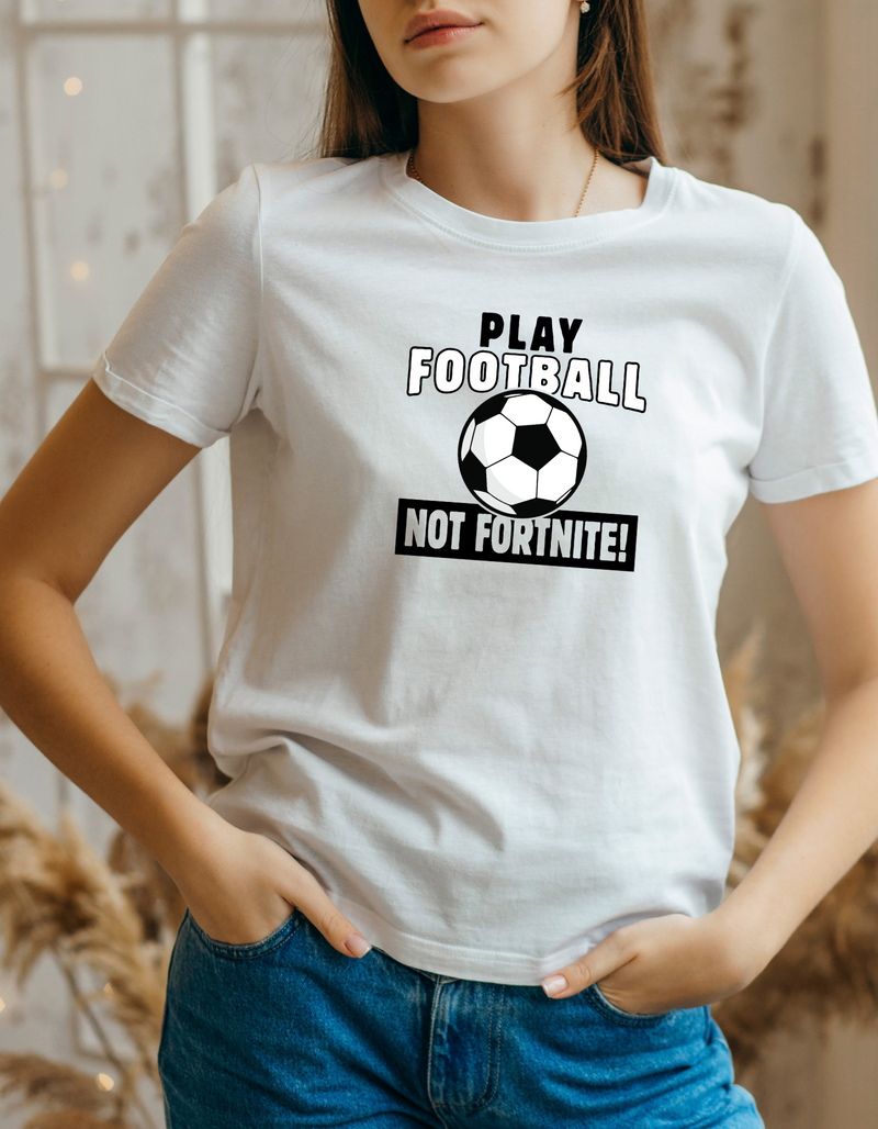A lady wearing a white t-shirt with the funny football slogan written on the front that reads 'Play Football Not Fortnite!