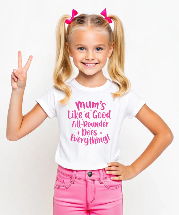 A little girl wearing a white t-shirt with Mums Like A Good All-rounder, Does Everything on the front. A T-Shirt. Premium Fabric, Multiple Junior Sizes, Perfect for Boys and Girls