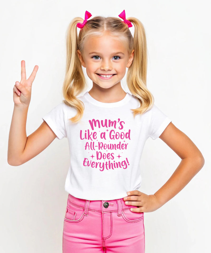 A little girl wearing a white t-shirt with Mums Like A Good All-rounder, Does Everything on the front. A T-Shirt. Premium Fabric, Multiple Junior Sizes, Perfect for Boys and Girls
