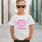 A little boy wearing a white t-shirt with Mums Like A Good All-rounder, Does Everything on the front. A T-Shirt. Premium Fabric, Multiple Junior Sizes, Perfect for Boys and Girls
