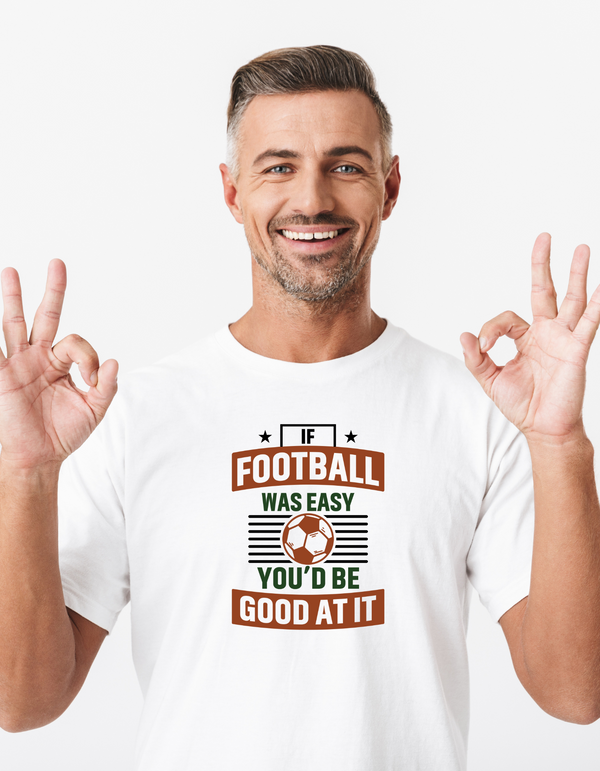 A man wearing a white T-shirt with the funny football slogan on the front that reads 'If Football Was Easy You’d Be Good at It'