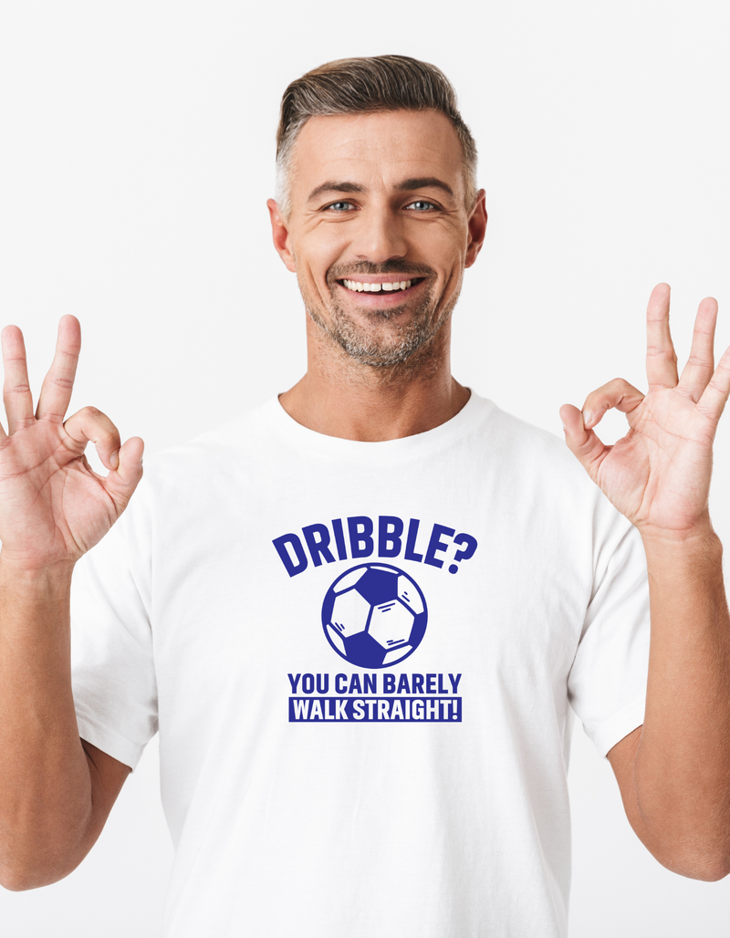 A man wearing a white t-shirt with a funny football slogan on the front that reads 'Dribble You Can Barely Walk Straight!'