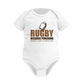 White baby onesie with rugby design and text on a white background, with a Cows Corner slogan saying Rugby because punching people in public is frowned upon