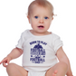 A little baby wearing a white baby grow with the funny football saying that says I love my dad 'Born To Play Football. Raised by a Football Dad!'