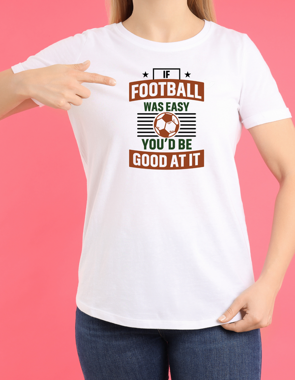 A lady wearing a white T-shirt with the funny football slogan on the front that reads 'If Football Was Easy You’d Be Good at It'