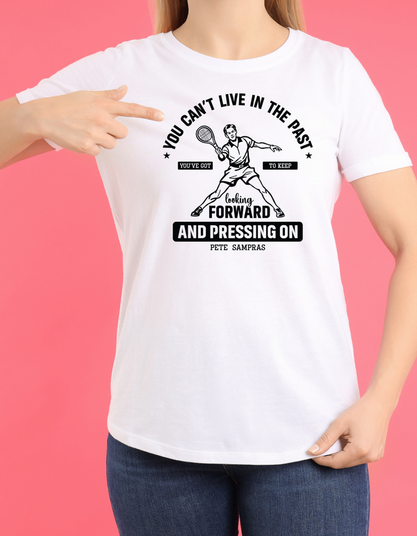 A white funny tennis t-shirt featuring the slogan on the front 'You Can’t Live in the Past, You’ve Got To Keep Looking Forward and Pressing On – Pete Sampras'