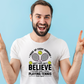 A man wearing a white t-shirt with funny tennis slogan on the front that reads 'A white ceramic mug with tennis slogan on the front that reads 'I Wake Up Every Morning and Still Can’t Believe I Actually Make a Living Playing Tennis.' 