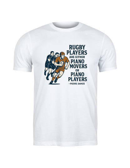 White t-shirt with rugby-themed graphic and text on a white background, with the slogan on the front 'Rugby Players Are Either Piano Movers or Piano Players – Pierre Danos
