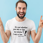A man wearing a white t-shirt with the funny tennis slogan on the front reading 'It’s Not Whether You Win or Lose but Whether I Win or Lose – Billie Jean-King!